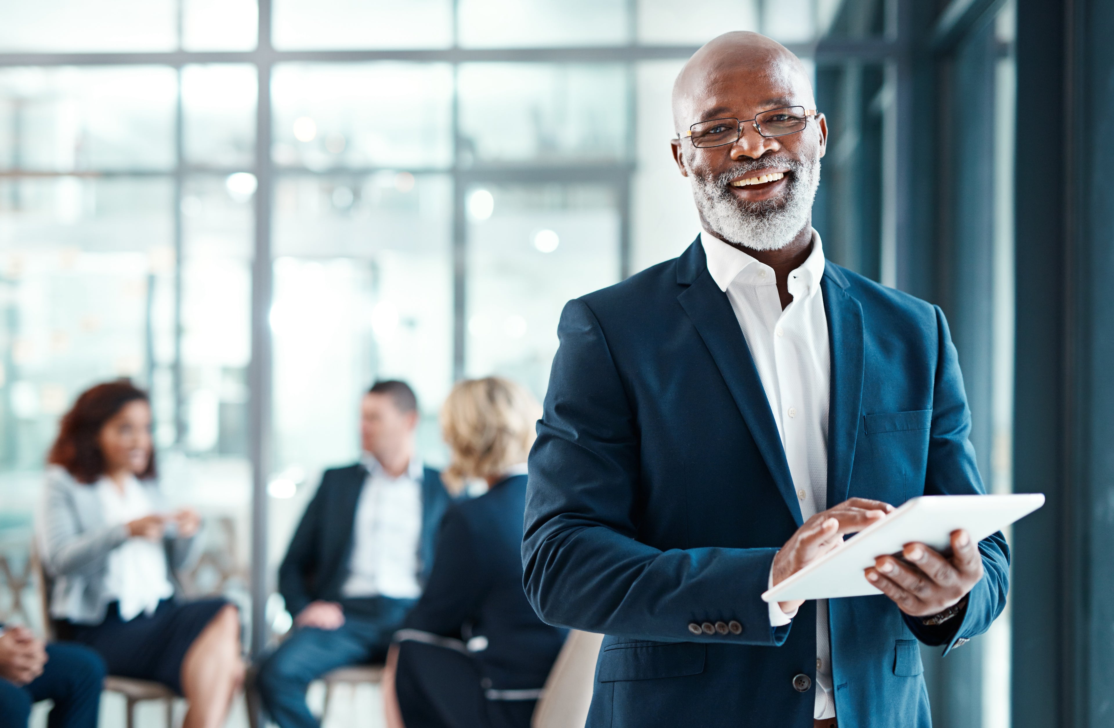 Businessman smiling confidently, representing industry recognition and leadership development through Master Programs.