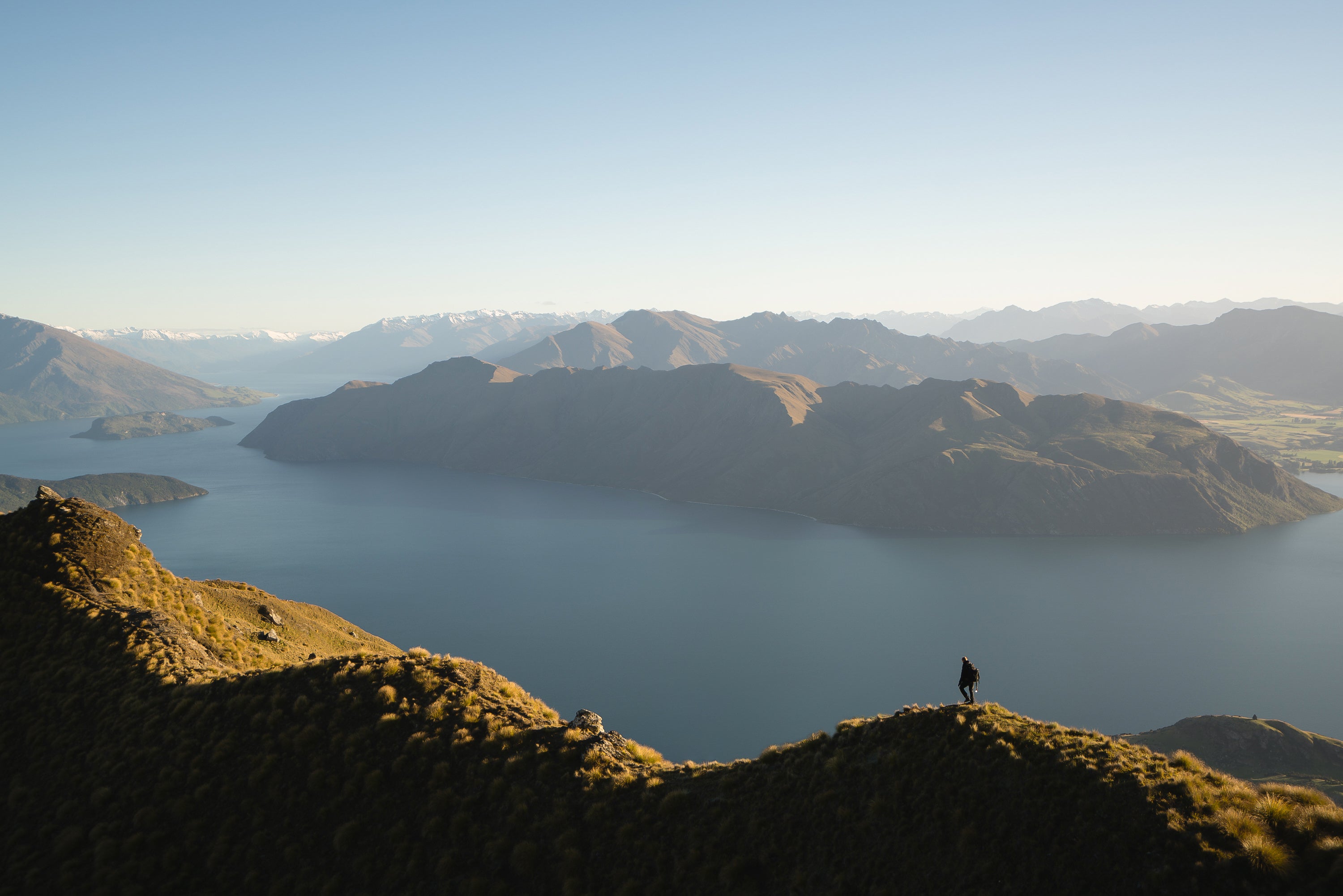 A scenic view of mountains around a lake, representing the journey of learning, growth, and achieving operational excellence with Lean Methods' expert guidance.