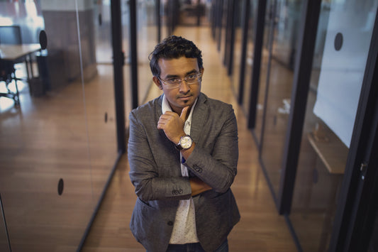 Businessman in a modern office, symbolizing leadership and strategic skills gained through Lean Six Sigma Black Belt training.