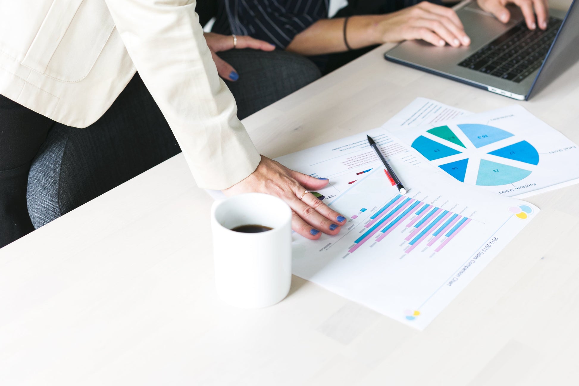 Professional reviewing a report, symbolizing data-driven decision-making and process improvement in Lean Six Sigma training.